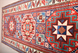 19th Century This very beautiful long rug from the Genje area presents a field design of polychrome diagonal stripes decorated with small usual medallion motifs. The distribution of the colours in the  ...