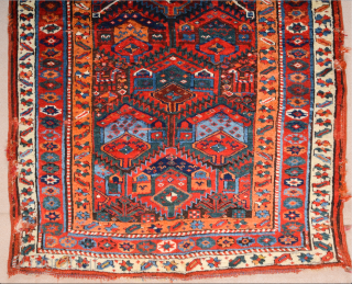 This Middle of the 19th Century Kurdish rug was woven in the mountainous region surrounding Lake Urmia. Items of this kind are known as “Sauj Bulag”, a name that derives from their  ...