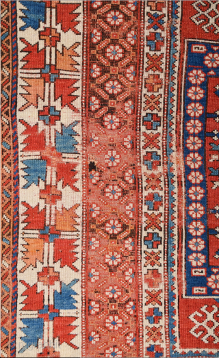 In this red-ground Late 18th Century West Anatolian Bergama, a powerful dark blue shield form encloses a large red stepped motif of almost the same size as well as a smaller, green  ...