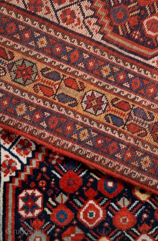 Second half 19th century South West Persian,Khamseh Rug
This very beautiful Khamseh woven by a Baharlu/Ainalu tribal group features a dense repeat of pomegranates in brilliant and diverse colours against a midnight blue  ...