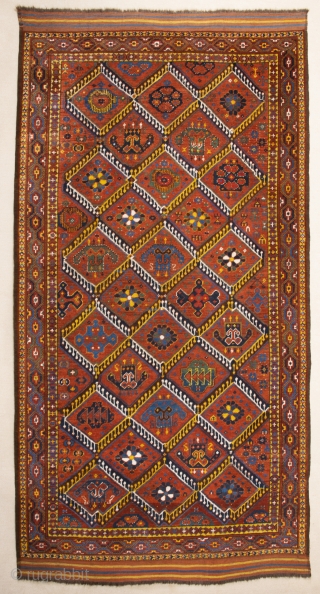 Middle of 19th Century,Central Asia, central Amu Darya valley Beshir ıkat design rug.An antique Beshir showing a diamond design; flowers, palmettes and botehs alternate in the various compartments. –The original kilim finishes  ...