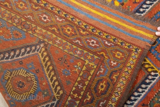 Middle of 19th Century,Central Asia, central Amu Darya valley Beshir ıkat design rug.An antique Beshir showing a diamond design; flowers, palmettes and botehs alternate in the various compartments. –The original kilim finishes  ...