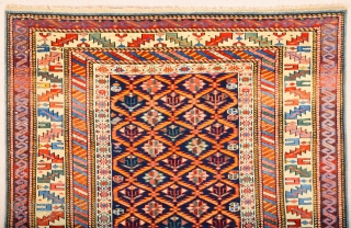 A blue-ground Kuba displaying a lattice design of yellow serrated leaves enclosing flowering shrubs. Mid 19th Century Shirvan Kuba Rug It has a nice pile on it. Lovely colors Size 110 x  ...