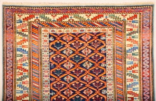 A blue-ground Kuba displaying a lattice design of yellow serrated leaves enclosing flowering shrubs. Mid 19th Century Shirvan Kuba Rug It has a nice pile on it. Lovely colors Size 110 x  ...