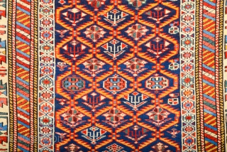 A blue-ground Kuba displaying a lattice design of yellow serrated leaves enclosing flowering shrubs. Mid 19th Century Shirvan Kuba Rug It has a nice pile on it. Lovely colors Size 110 x  ...