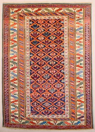 A blue-ground Kuba displaying a lattice design of yellow serrated leaves enclosing flowering shrubs. Mid 19th Century Shirvan Kuba Rug It has a nice pile on it. Lovely colors Size 110 x  ...