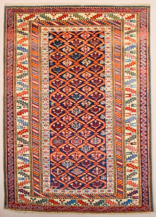 A blue-ground Kuba displaying a lattice design of yellow serrated leaves enclosing flowering shrubs. Mid 19th Century Shirvan Kuba Rug It has a nice pile on it. Lovely colors Size 110 x  ...