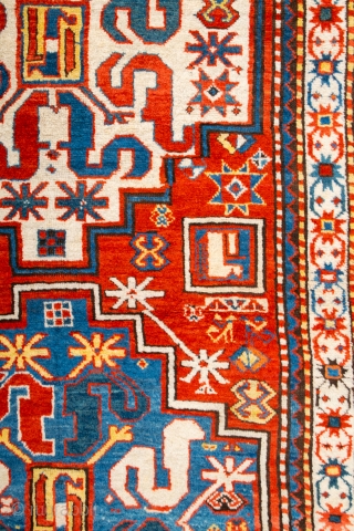 This Middle of 19th Century antique red-ground Chondzoresk is entirely filled by two immaculately drawn medallions in white and light blue, each enclosing the design of a central rectangle and eight snake-like  ...