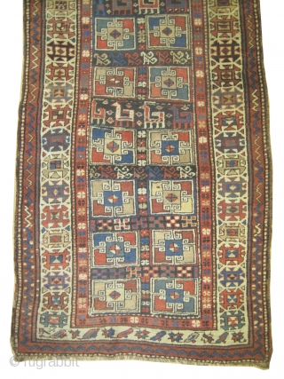 	

Gendja Caucasian circa 1910 antique. Collector's item. Size: 300 x 103 (cm) 9' 10" x 3' 5"  carpet ID: K-4093
High pile, good condition, soft, the black color is oxidized, geometric design,  ...