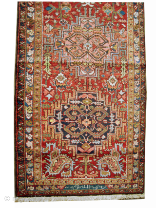 

Heriz Persian dated 1320 = 1902 antique, 106 x 345 cm, ID: K-5460
Vegetable dyes, the black knots are oxidized, the knots are hand spun wool, the shirazi borders are woven on two  ...