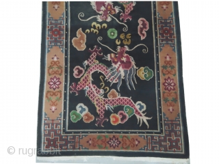 Tibetan dragon rug, knotted circa in 1935, semi antique, 118 x 205 cm, carpet ID: BRDI-37
The knots are hand spun wool, the background in indigo with two dragons, thick pile in perfect  ...