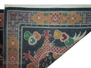 Tibetan dragon rug, knotted circa in 1935, semi antique, 118 x 205 cm, carpet ID: BRDI-37
The knots are hand spun wool, the background in indigo with two dragons, thick pile in perfect  ...