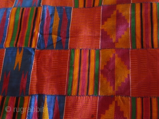 Ghanean Asanti cloth.  24 strips of 9cm widths.  Approximately 320cm x 240cm.
Mostly cotton with a great variety of supplementary weft float patterns. A fine example.  Very good condition.   ...