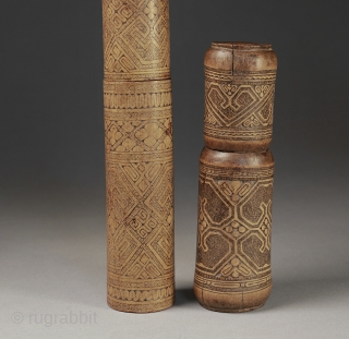 Antique bamboo lime boxes elaborately covered with many traditional patterns.
Timor, Indonesia.
20 cm and 14 cm.                  