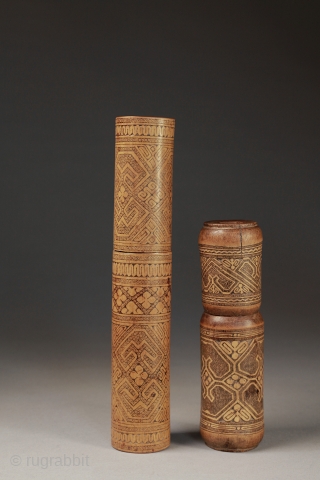 Antique bamboo lime boxes elaborately covered with many traditional patterns.
Timor, Indonesia.
20 cm and 14 cm.                  