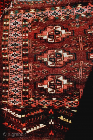 This large and deep Turkmen chuval has many characteristics of an early collectible piece: lots of offset symmetric knotting, spacious drawing with nicely shaped guls, saturated aubergine/brown red ground, apricot-rose madder dye,  ...