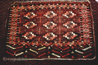 This large and deep Turkmen chuval has many characteristics of an early collectible piece: lots of offset symmetric knotting, spacious drawing with nicely shaped guls, saturated aubergine/brown red ground, apricot-rose madder dye,  ...