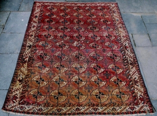 An early Turkmen main carpet, probably Tekke, with nicely proportioned guls, a bold 'boat' main border and interesting minor borders. Localized heavy wear, holes and other losses, with some fading and stains.  ...