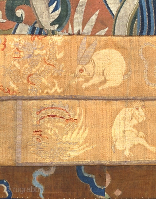 A composed silk textile that displays Chinese zodiac figures. Brocaded silk sleeve bands (circa 1800) are surrounded by a frame of pieced Dragon kesi (slitweave tapestry) with gold wrapped highlights, probably K'ang  ...