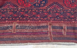 Description and origin: antique Ersari carpet, from Turkmenistan. A soft red ground with three columns of eleven large Guls surrounded by a narrow angular border. Excellent pile with slight surface mark, attractive  ...