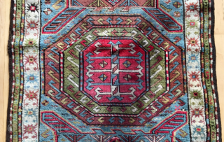 Origin and description: Caucasian carpet with traditional stars´ borders and a main field between Farchalo and Karachopf designs. Interesting dominance of green colour.

Age: around 100 years old.

Dimensions: 224 cm x 107 cm.

Condition:  ...