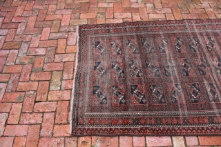 Persian Baluch circa late 19th, early 20th century.  A beautiful rug in worn but good overall condition and not broken.
Approximate Dimensions:  6' 3 3/4" x 3' 9 1/4".  Price  ...
