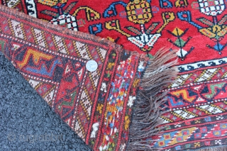 Afshar inspired Khamseh pomegranite rug. 19th century to 1900. Size 3'8" x 2'8". Both endings and sides complete. One end with sumack finish. This is a small format rug not a bagface.  ...