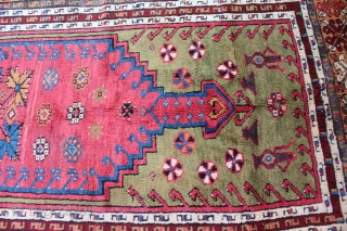 Turkish Mudjar prayer rug. 19th century. Size is 60" x 44 1/2". Ends and sides are complete but no kilim remains on either end. Nice green background and some natural purple.   ...