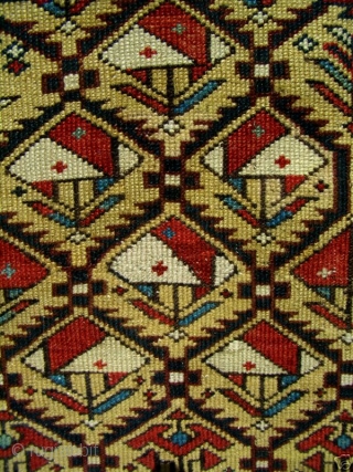 GREAT RARE YELLOW FIELD ANTIQUE CAUCASIAN MARASALI SHIRVAN PRAYER RUG

Classic textbook design with 100% natural dyes. It possesses evenly low allover pile condition to the tops of the knots. Minor repairs to  ...