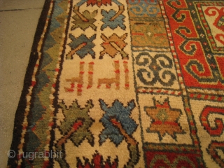 A Kazak Rug, 7' 11" x 3' 10", in fine condition, dated 1312AH/1894AD, with a dramatic "crab" border.               