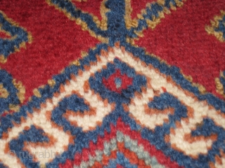 A late 19th Century Yuruk Rug, 6' 7" x 3' 10".  Overall good condition, with some small repairs present.  Re-wrapped selvedges over original side cords.      