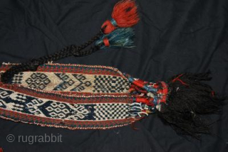 This is a very rare Qashqai or Bhaktiari horse bridle ca 1920 (or older), made from warpfaced patterned band and decorated with a lot of kauri shells and old ceramic turkoois beads.  ...