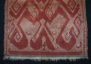 Tampan with unusual design: a single human like figure on a boat with above a dynamic atmosphere with spirals and animals (birds). It's a ceremonial textile from Sumatra. 19th century. Size 65  ...