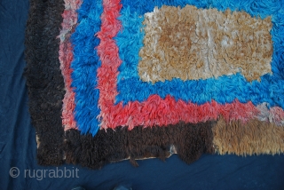 Very rare Kirghiz fur rug or cover made from pieces of fur sewn together (sheep, yak, mountain goat). The red and blue parts are dip-dyed first. Late 19th century. All natural dyes.  ...