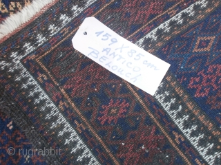 Antique fine BALOUCH carpet.
May-be a Belouch knotted to ARAB tribe. 
In good condition = FULL pile.
Only damages upon the ends.

SIZE: cm. 170 x 95. circa
Great design and colors for this
very original piece.
The  ...