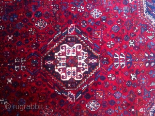 This antique rug is an old hand knotted Qashqai(also known as Shiraz), came in 308cm * 210cm, made of fully saturated shiny colored goat hair. The flowers and shapes are woven beautifully  ...