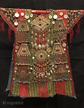 Turkmen tekke vintage handmade baby kaftan 

Size: 
Height : 50 cm
Lenght : 35 cm

Vintage Traditional Nomad child ceremonial dress & vest a child would wear and The Dress is decoreted by hand  ...