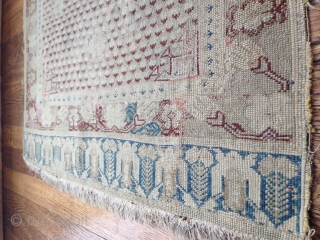 18th century rug. fine weave. size approximately 2' x 3'6".  mends, repairs/restorations varying in expertise, back side border and center have very old glue. some splits, faux applied fringe sewn on  ...