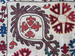 Kyrgyz tribal mirror cover. Silk embroidery on hand loomed cotton. Only light madder embroidery is wool. Size: 55 cm x 53 cm with 7 cm long tassels (22” X 21” x 3”).  ...