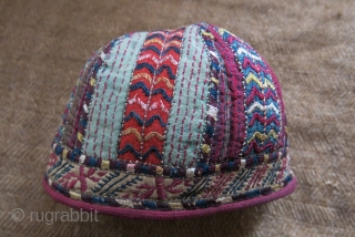 Turkmen Tekke ethnic child hat, silk embroidery on hand loomed cotton and silk. Embroidered trim and cotton lining. Circa 1900 or earlier.
Size: 5” – 13 cm circumference / 4” – 10 cm  ...