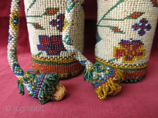 A pair of antique micro glass beaded bottle jackets. Presumably made by Greeks in Western Turkey in late 19th century. Despite their age, they are in great condition. Even the corks are  ...