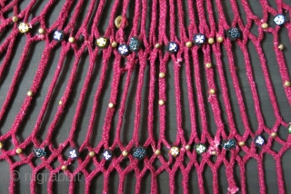 Afghanistan Pashtun tribal wool braided talismanic hanging. Upper part is like small bag where something can be put in the net part. Beaded rosette / handmade button like decorations with metal buttons  ...