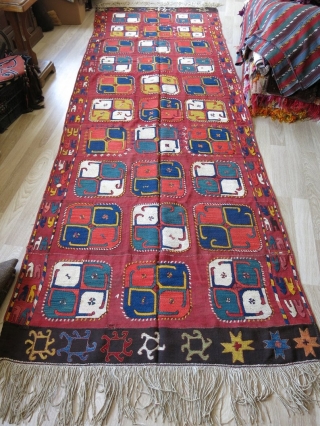 Vintage hand embroidered kilim - flat weave from Uzbekistan, made by the tribe named Lakai. Circa 1890s. It has hand dyed and hand spun natural saturated colors. It has stylized pinwheel and  ...