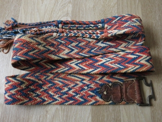 Traditional camel decoration belt from Rajasthan, India. It is cotton weaving with natural dyes. It has nice tassels along with a in drop metal buckle, which is decorated with leather. It is  ...