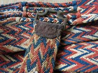Traditional camel decoration belt from Rajasthan, India. It is cotton weaving with natural dyes. It has nice tassels along with a in drop metal buckle, which is decorated with leather. It is  ...
