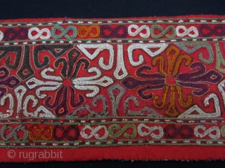 Turkmen Chodor silk embroidered costume fragment. Adras ikat backing. Circa 1900.
Size: 120 cm x 10 cm (47.2"x 3.9").               