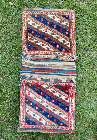 Beautiful Tribal Saddle Bag/Khordjin from southern Caucasus complete with striped kilim back and closure loops. Most likely from Moghan region and possibly woven by a member of the Shahsavan Tribal confederation in  ...
