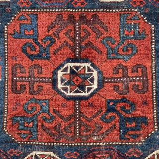 Beautiful Baluch Bagface with Star in octagon pattern and pomegranates jewelry ? on the sides framed by a nicely drawn ivory border. 
19th century 
31” x 29” - 78 x 73 cm. 
