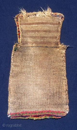 Kurdish (Jaff) salt bag, 13 



































Kurdish (Jaff) salt bag, 13 X 25".  Sumak face, piled bottom, flat woven back.  Good glowing natural dyes with good greens in sumak and pile.

















x  ...