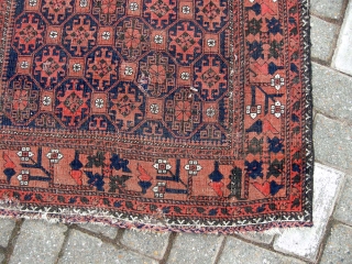 An antique belouch rug nice colours even corrosion and a few other issues as seen but a very pretty antique rug will clean well approx. 4ft9 x 2ft9.     